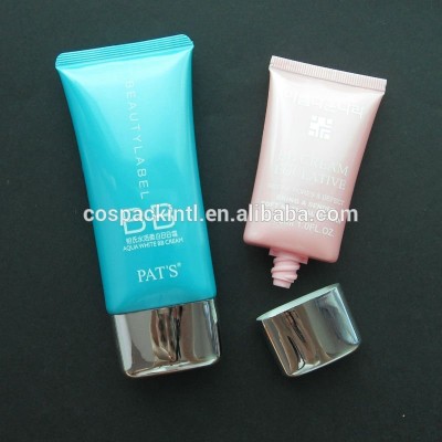 Oval flat plastic cosmetic tube with caps